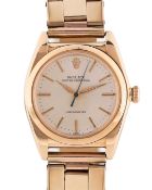 A GENTLEMAN'S 14K SOLID GOLD ROLEX OYSTER PERPETUAL CHRONOMETER "BUBBLE BACK" BRACELET WATCH CIRCA