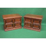 Pair of mahogany side cabinets the tops having moulded edges over two cupboard doors with brass