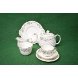 Minton Greenwich S.705 teaset having floral and leaf decoration on a white ground with gilt