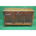Oak coffer the top lifting to reveal storage space, the front having three fielded panels and