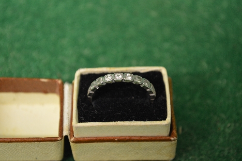 18ct white gold ladies ring set with single band of ten small diamonds Please note descriptions