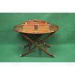 20th century mahogany butlers tray on stand having four pierced folding carry handles supported on a