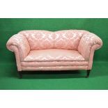 19th century two seater settee having scrolled arms and supported on square tapering legs ending