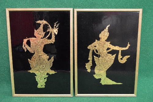 Pair of black lacquered panels having gilt highlighted pictures of Indian female dancers, in