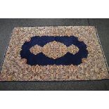 Blue ground rug having blue, red and pink floral pattern - approx 3m x 1.98m Please note