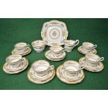 Paragon teaset having floral decoration with yellow and gilt borders to comprise: cake plate, milk