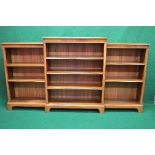 Walnut breakfront bookcase having stepped top with moulded edge, the centre section having three