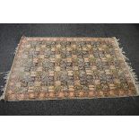 Peach ground rug having pale green, brown and pink pattern - approx 2.72m x 1.81m Please note