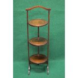 Mahogany folding three tier cake stand having top carrying handle over three folding circular