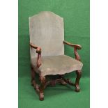 Oak open upholstered armchair having padded back supported by scrolled open arms leading to padded