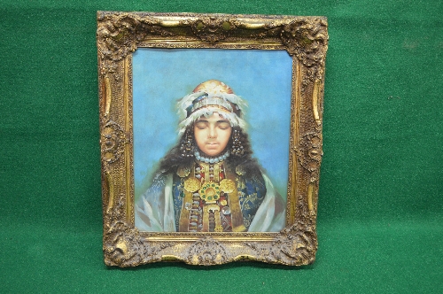 20th century unsigned oil on canvas of a young child wearing feathered headdress and ceremonial