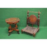 Possibly Indian carved low seated chair having carved panelled back supported by turned columns