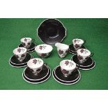 Royal Albert Masquerade teaset having decoration of red and black roses on a white and black