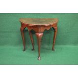 Period oak fold over tea table having D shaped top over a shaped frieze, standing on cabriole legs -