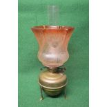Brass oil table lamp on stand having patterned frosted red glass shade and clear chimney - 18"