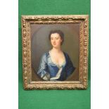 19th century unsigned oil on canvas portrait of a young lady wearing a blue and white dress with
