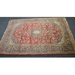 Red ground carpet having blue ground border and floral pattern - approx 3.01m x 1.98m Please note