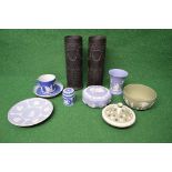 Group of Wedgwood Jasperware to comprise: pair of black cylindrical vases, dark blue teacup and