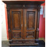 19th century Continental walnut wardrobe having moulded cornice over two panelled doors opening to