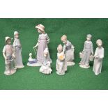 Group of eight Lladro figures to comprise: girl holding fruit, small child with lamb, fishing boy,