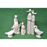 Group of five Lladro and Nao figures to comprise: two ducks, figure of a girl holding fruit,