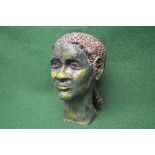 20th century green glazed pottery bust of a young girl having brown braided hair - 12" tall Please