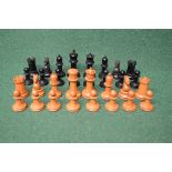 Full treen chess set having ebonised and bare wood pieces (some pieces af) Please note