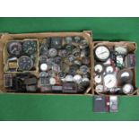 Two boxes of approx fifty five dashboard instruments, clocks, ammeters and gauges. Please note