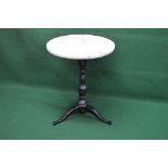 Circular white marble topped table having metal column support leading to three swept legs - 23.