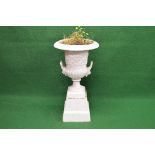 Cast iron white painted two handled garden urn standing on a square plinth base - 34.25" tall Please