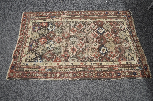 Brown ground rug having cream and black pattern - 1.53m x 1.05m Please note descriptions are not