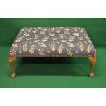 Large 20th century foot stool having over stuffed seat with floral upholstery, standing on four