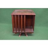 Mahogany tabletop revolving bookstand having four book sections with moulded uprights, standing on