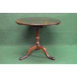 19th century mahogany tip top occasional table the top being supported on a bird cage movement and