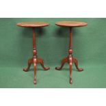 Pair of 20th century mahogany wine tables having circular tops supported on turned columns leading