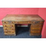 Victorian pine desk the top having moulded edge over three drawers with turned knob handles,