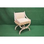 Painted X frame chair having padded back and seat supported on a stretchered X frame Please note