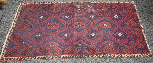 Blue ground rug having red and peach pattern - 2.1m x 1.13m Please note descriptions are not