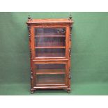 Victorian mahogany glazed cabinet the top having turned finials over two glazed doors with