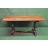 20th century oak refectory dining table the top being supported on two bulbous stretchered legs,