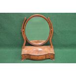 19th century mahogany serpentine fronted box base mirror having oval mirror supported on moulded