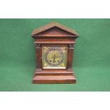 Oak cased mantel clock having brass face with silvered dial, black Roman Numerals and black