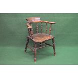 Bow back captains chair having scrolled arms supported by turned spindles leading to a solid seat,