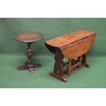 Small oak drop leaf occasional table having bow drop leaves - 32" long together with a circular