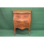 20th century bombe fronted chest of three drawers with brass handles and shaped frieze, standing