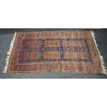 Red and blue ground rug having red, blue, white and brown pattern with end tassels - 1.98m x 1.07m