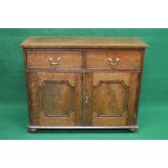 Mahogany side cabinet having two drawers with brass handles over two panelled cupboard doors each