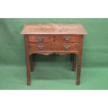 19th century oak side table having two short and one long drawer over a shaped frieze, standing on