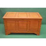 20th century camphor wood chest having three panel top and front, the top opening to reveal