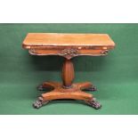 19th century rosewood fold over card table the top opening to reveal red baized playing surface,